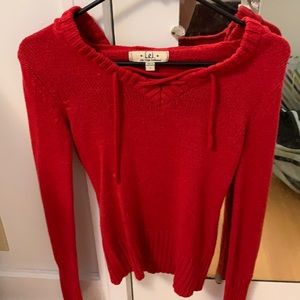 Red sweater with tie in front